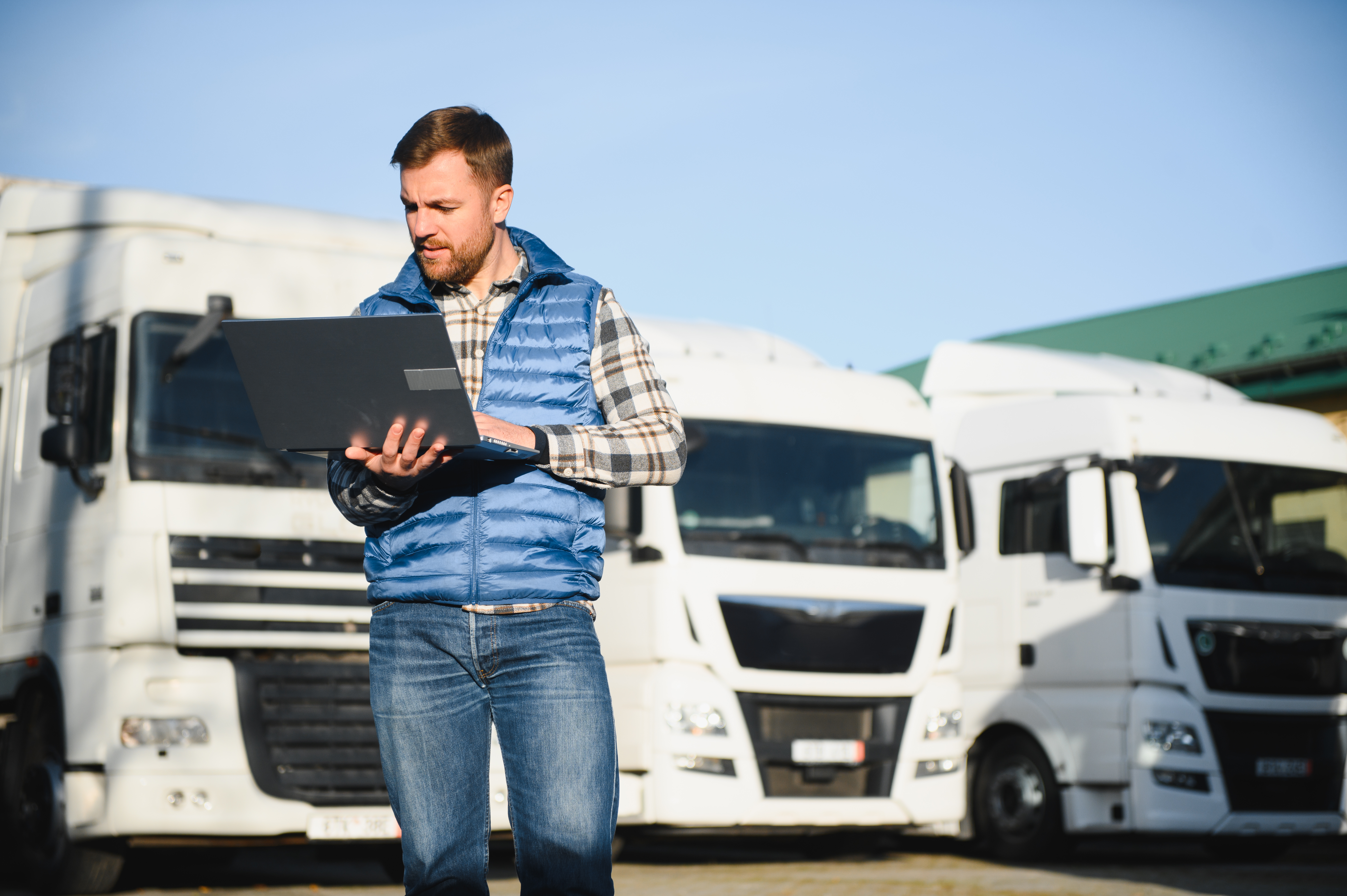 The Truck Driver Uses A Laptop To Confirm The Deli 2025 03 16 06 55 00 Utc
